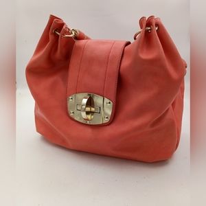 Orange Shoulder Bag with Slouchy Design and Gold Hardware